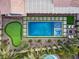 Aerial view of a backyard with a pool, spa, putting green, and patio area at 5434 Pendini Point Ct, Las Vegas, NV 89141