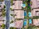 Aerial view of homes showcasing pools and meticulously landscaped yards at 5434 Pendini Point Ct, Las Vegas, NV 89141