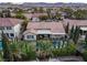 Stunning backyard featuring a private pool, lush landscaping, and a covered patio perfect for outdoor entertaining at 5434 Pendini Point Ct, Las Vegas, NV 89141