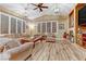 Inviting living room with hardwood floors, neutral colors, and plantation shutters at 5434 Pendini Point Ct, Las Vegas, NV 89141