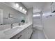 Modern bathroom with double sinks, spacious vanity, framed mirror, and shower-tub combination at 5507 Nickel Ridge Way, Las Vegas, NV 89122