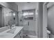 Sleek bathroom showcasing a glass-enclosed shower, modern fixtures, and a stylish vanity at 5507 Nickel Ridge Way, Las Vegas, NV 89122