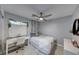 Cozy bedroom features a calming color scheme, natural light, and comfortable workspace at 5507 Nickel Ridge Way, Las Vegas, NV 89122