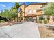 Exterior of community building with well-maintained landscaping, benches, and a welcoming entrance at 5507 Nickel Ridge Way, Las Vegas, NV 89122