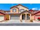 Charming two-story home featuring a two-car garage and covered porch, perfect for Gathering living at 5507 Nickel Ridge Way, Las Vegas, NV 89122