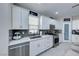 Updated kitchen featuring white cabinets, subway tile backsplash, and stainless steel appliances at 5507 Nickel Ridge Way, Las Vegas, NV 89122