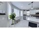 Bright eat-in kitchen featuring stainless steel appliances and tile flooring at 5507 Nickel Ridge Way, Las Vegas, NV 89122