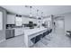 Modern eat-in kitchen featuring stainless steel appliances, gray backsplash and large kitchen island at 5507 Nickel Ridge Way, Las Vegas, NV 89122