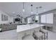 Open-concept kitchen featuring a marble island, pendant lighting, and stainless steel appliances at 5507 Nickel Ridge Way, Las Vegas, NV 89122