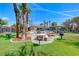 Resort-style community pool area featuring picnic tables, BBQ grills and lush landscaping at 5507 Nickel Ridge Way, Las Vegas, NV 89122