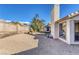 Low maintenance backyard featuring gravel, patio and mature landscaping at 5732 Colwood Ln, Las Vegas, NV 89130