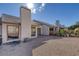 Low maintenance backyard featuring gravel, patio, mature landscaping and home exterior at 5732 Colwood Ln, Las Vegas, NV 89130