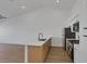 Open kitchen featuring stainless steel appliances, quartz counters, and wood laminate floors at 5732 Colwood Ln, Las Vegas, NV 89130