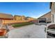 Spacious backyard featuring artificial turf, brick trim, concrete patio, block wall, and patio furniture at 5736 Clear Haven Ln, North Las Vegas, NV 89081