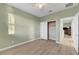 Bedroom featuring hardwood floors, white trim, and a closet at 5736 Clear Haven Ln, North Las Vegas, NV 89081