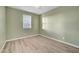 Bedroom featuring hardwood floors, white trim, and a window with natural light at 5736 Clear Haven Ln, North Las Vegas, NV 89081