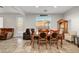 Open dining area featuring a wooden table, seating for six, and natural light at 5736 Clear Haven Ln, North Las Vegas, NV 89081