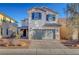 Inviting two-story home featuring a two-car garage and desert landscaping in the front yard at 5736 Clear Haven Ln, North Las Vegas, NV 89081