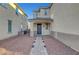 Charming front porch with a brick pathway and covered entryway, providing a welcoming entrance at 5736 Clear Haven Ln, North Las Vegas, NV 89081