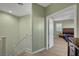 Upstairs hallway leading to a bedroom with wooden floors at 5736 Clear Haven Ln, North Las Vegas, NV 89081