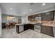 Well-equipped kitchen with stainless steel appliances and a connected dining area at 5736 Clear Haven Ln, North Las Vegas, NV 89081