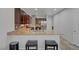 Modern kitchen featuring granite countertops, stainless steel appliances, and barstool seating at 5736 Clear Haven Ln, North Las Vegas, NV 89081