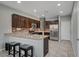 Modern kitchen with stainless steel appliances, ample cabinet space, and barstool seating at 5736 Clear Haven Ln, North Las Vegas, NV 89081