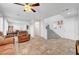 Spacious living room with tile flooring, comfortable seating, and a ceiling fan at 5736 Clear Haven Ln, North Las Vegas, NV 89081