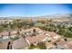 Stunning aerial view of a community with golf course, ponds, and mountain views at 5891 Alfano Ave, Pahrump, NV 89061