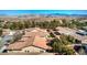 Aerial view of the backyard of a home showcasing trees and neighboring roofs at 5891 Alfano Ave, Pahrump, NV 89061