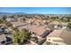 High aerial view of desert community homes with tile roofs, landscaped yards, showcasing overall neighborhood layout at 5891 Alfano Ave, Pahrump, NV 89061