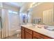 Bathroom features a shower-tub combo and ample counter space at 5891 Alfano Ave, Pahrump, NV 89061