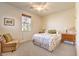 Cozy bedroom featuring a ceiling fan, and a comfortable seating area at 5891 Alfano Ave, Pahrump, NV 89061