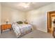 Inviting bedroom with neutral walls, carpet, ceiling fan, and a well-lit ambiance at 5891 Alfano Ave, Pahrump, NV 89061