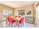 Bright dining room with large window and sliding door, comfortably seating six at 5891 Alfano Ave, Pahrump, NV 89061