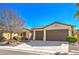 Charming single story home featuring a three car garage and well maintained yard at 5891 Alfano Ave, Pahrump, NV 89061