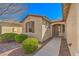 Inviting home entrance with a decorative door and manicured landscaping at 5891 Alfano Ave, Pahrump, NV 89061