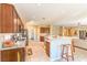 Spacious kitchen featuring dark wood cabinets, granite countertops, and an open design at 5891 Alfano Ave, Pahrump, NV 89061