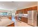 Bright kitchen with stainless steel appliances, granite countertops, and ample cabinet space at 5891 Alfano Ave, Pahrump, NV 89061