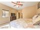 Calm main bedroom features a large bed, dresser with a TV, a window, and neutral color scheme for relaxation at 5891 Alfano Ave, Pahrump, NV 89061