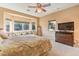 Inviting main bedroom with a cozy bay window, dresser, TV, and neutral tones creating a relaxing retreat at 5891 Alfano Ave, Pahrump, NV 89061