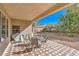 Inviting covered patio perfect for outdoor dining and entertaining with views of the backyard at 5891 Alfano Ave, Pahrump, NV 89061