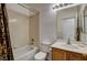 Bathroom featuring bathtub with shower, vanity with white countertop, and tiled flooring at 5965 Poplar Tree St, Las Vegas, NV 89148