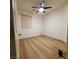 Empty bedroom featuring laminate flooring, white walls, and a window with blinds at 5965 Poplar Tree St, Las Vegas, NV 89148