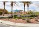 The Southern Terrace Club entrance featuring stone signage, mature palms, and beautiful landscaping at 5965 Poplar Tree St, Las Vegas, NV 89148