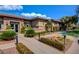 Southern Terrace Club exterior featuring stone accents and lush landscaping with manicured bushes at 5965 Poplar Tree St, Las Vegas, NV 89148