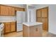 A kitchen featuring an island with a white tiled countertop at 5965 Poplar Tree St, Las Vegas, NV 89148