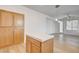 Bright living room featuring wood-look flooring and a glass paneled door at 5965 Poplar Tree St, Las Vegas, NV 89148