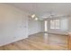 Bright living room featuring wood-look flooring and a view to the outside at 5965 Poplar Tree St, Las Vegas, NV 89148