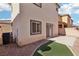 View of the backyard and patio with a grassy area at 6116 Casa Antiqua St, North Las Vegas, NV 89081